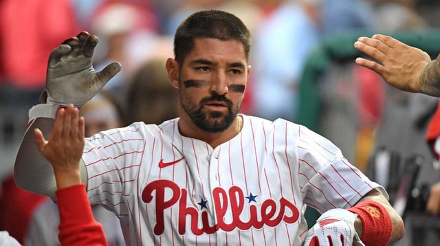 Aug 18, 2025; Philadelphia, Pennsylvania, USA; Philadelphia Phillies outfielder Nick Castellanos (8) celebrates in the dugout after scoring a run during the second inning against the Seattle Mariners at Citizens Bank Park. Mandatory Credit: Eric Hartline-Imagn Images