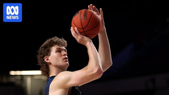 Ben Griscti of the Adelaide 36ers warms up by shooting the basketball