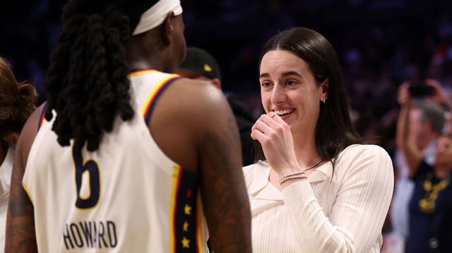 Aug 29, 2025; Los Angeles, California, USA; Indiana Fever guard Caitlin Clark (22, right) celebrates with forward Natasha Howard (6) after defeating the Los Angeles Sparks 76-75 at Crypto.com Arena. Mandatory Credit: Kiyoshi Mio-Imagn Images