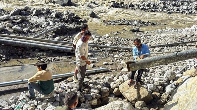 A water pipeline being repaired after a landslide and heavy rains in Manali in Himachal Pradesh on Friday. (PTI Photo)