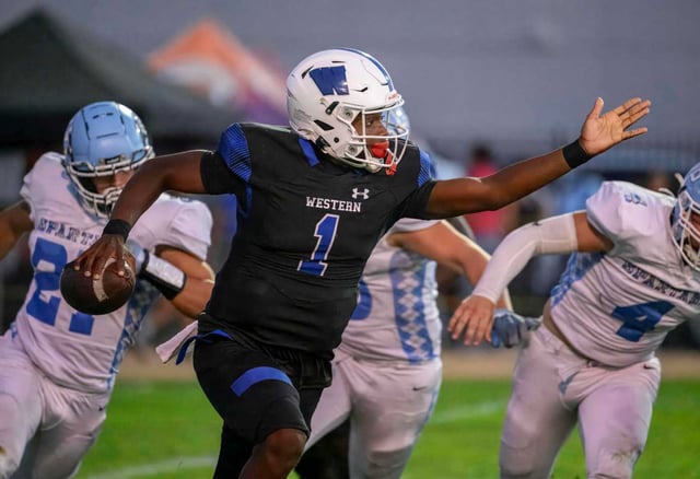 Western quarterback Chance Thomas scrambles away from Villa Park defenders as he looks for a receiver in a nonleague football game in Anaheim on Friday, Aug. 29, 2025. (Photo by Paul Rodriguez, Contributing Photographer)
