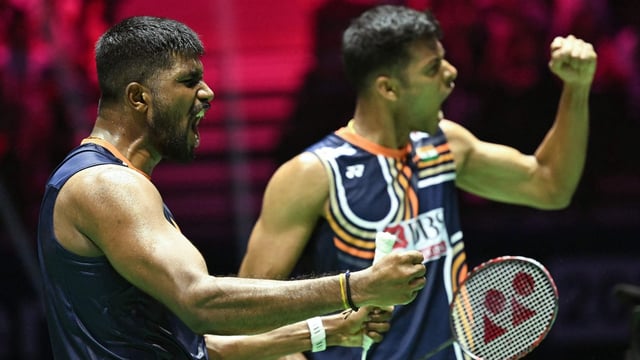 India's Satwiksairaj Rankireddy and Chirag Shetty celebrate after beating Malaysia's Aaron Chia and Wooi Yik Soh in the quarterfinal round.