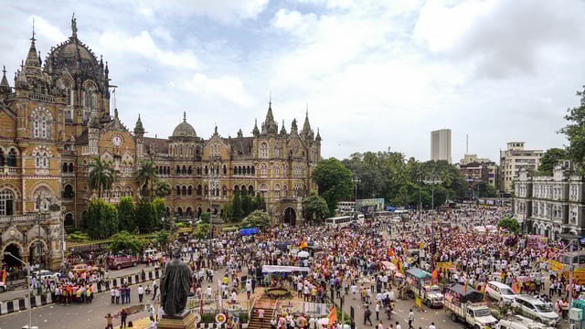 Supporters of activist Manoj Jarange Patil, who is on indefinite hunger strike demanding Maratha reservation, gather outside Chhatrapati Shivaji Maharaj Terminus to join his agitation in Mumbai, on Saturday, 30 August 2025.