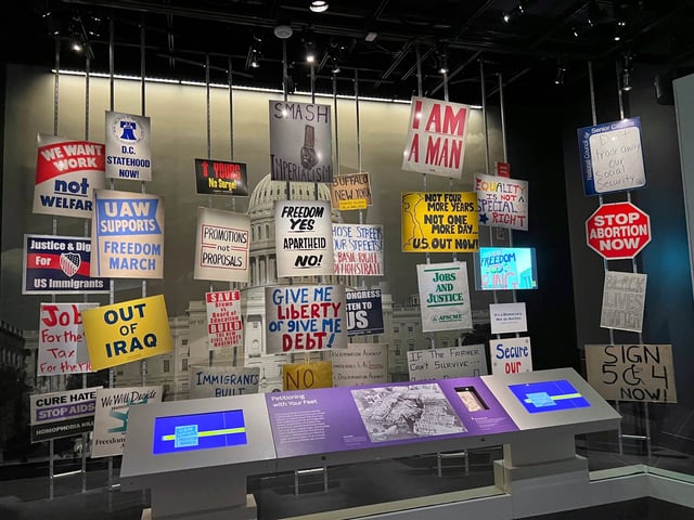 Protest signs from a selection of historic demonstrations are displayed at the Smithsonian’s National Museum of American History, Aug. 13, 2025, representing the causes of anti-war and civil rights activists, the tea party, farmers and other populist movements. (AP Photo/River Zhang)