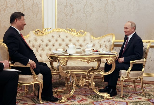 Russian President Vladimir Putin and Chinese President Xi Jinping have tea following their talks in Moscow, Russia, May 8, 2025. Sputnik/Mikhail Metzel/Pool via REUTERS/File Photo