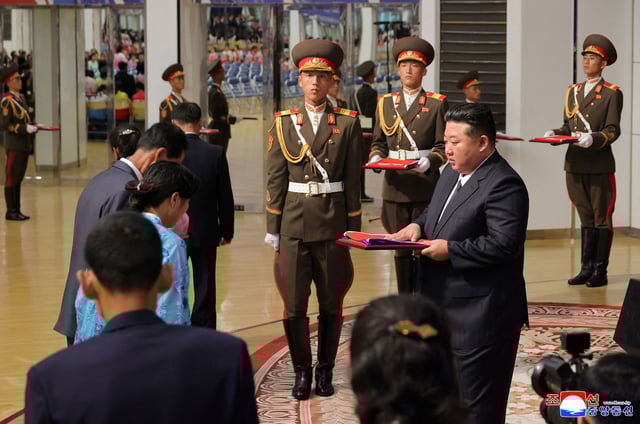 North Korean leader Kim Jong Un meets families of soldiers who participated in overseas military operations, in Pyongyang, North Korea, in this picture released by the Korean Central News Agency on August 30, 2025.