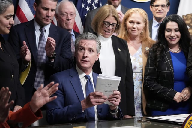 California Gov. Gavin Newsom signs legislation calling for a special election on a redrawn congressional map on Thursday, Aug. 21, 2025, in Sacramento, Calif. (AP Photo/Godofredo A. Vásquez)