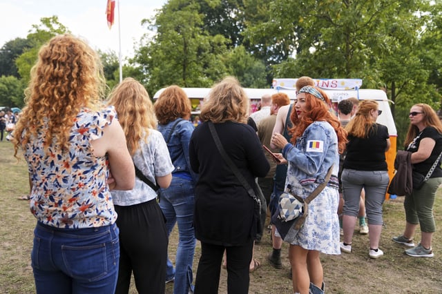 Participants wait in line for tickets during the Red Head Days festival in Tilburg, Netherlands, Saturday, Aug. 30, 2025. (AP Photo/Virginia Mayo)