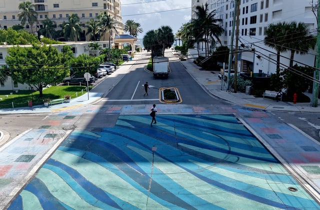 The intersection at Breakers Avenue and Terramar Street in Fort Lauderdale, shown on Thursday, Aug. 28, 2025, has a wave pattern in the center, with the crosswalks painted in squares of color. It's an example of the street artwork that the state Department of Transportation has ordered to be removed. (Mike Stocker/South Florida Sun Sentinel)
