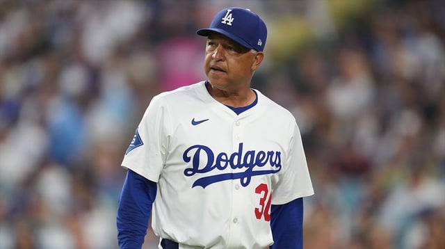 Aug 27, 2025; Los Angeles, California, USA; Los Angeles Dodgers manager Dave Roberts (30) walks back to the dugout in the sixth inning against the Cincinnati Reds at Dodger Stadium. Mandatory Credit: Kirby Lee-Imagn Images.