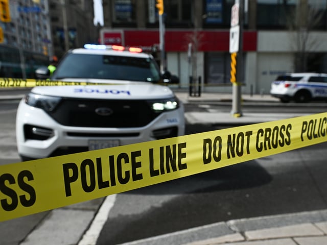 OTTAWA, CANADA APRIL 29: Yellow police tape and Police vehicles are blocking a stretch of Rideau Street following a dramatic police-involved shooting near the busy Rideau Centre mall, in Ottawa, Ontario, Canada, on April 29, 2025. Ottawa Police say officers responded to reports of a man with a firearm and shot him during the encounter. He was taken to hospital in critical condition but has since stabilized. The Special Investigations Unit (SIU) is investigating the incident. (Photo by Artur Widak/NurPhoto via Getty Images)