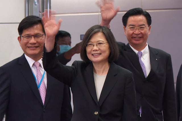 FILE - In this image made from video, Taiwan's Presidential office secretary general Lin Chia-lung, left, President Tsai Ing-wen, center, and Foreign Minister Joseph Wu wave before Tsai's departure on an overseas trip at Taoyuan International Airport in Taipei, Taiwan, Wednesday, March 29, 2023. (AP Photo/Johnson Lai, File)