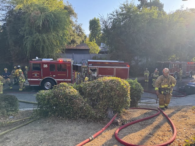 Firefighters respond to a house fire in Pasadena on Saturday, Aug. 30, 2025.