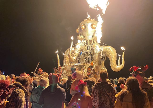 Attendees dance during the annual Burning Man Festival in the early morning of September 5, 2023. 