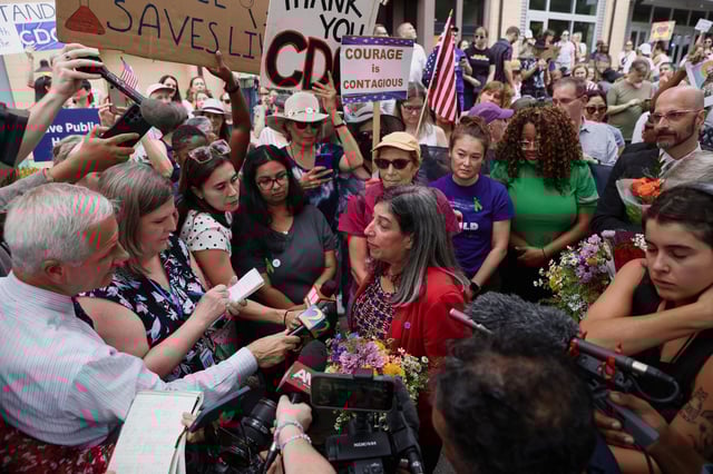 Former Centers for Disease Control and Prevention (CDC) Chief Medical Officer Debra Houry speaks to the media during a protest outside the CDC campus, a day after the White House fired CDC director Susan Monarez and several top officials resigned, in Atlanta, Georgia, U.S., August 28, 2025. REUTERS/Alyssa Pointer
