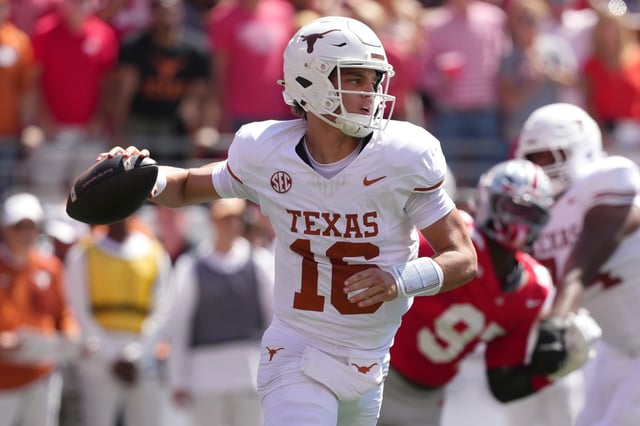 Quarterback Arch Manning #16 of the Texas Longhorns passes the ball during the first quarter against the Ohio State Buckeyes at Ohio Stadium on August 30, 2025 in Columbus, Ohio.
