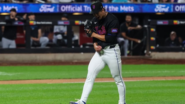Aug 29, 2025; New York City, New York, USA; New York Mets starting pitcher Jonah Tong (21) reacts after striking out Miami Marlins catcher Liam Hicks (not pictured) to end the top of the fifth inning at Citi Field. Mandatory Credit: Vincent Carchietta-Imagn Images