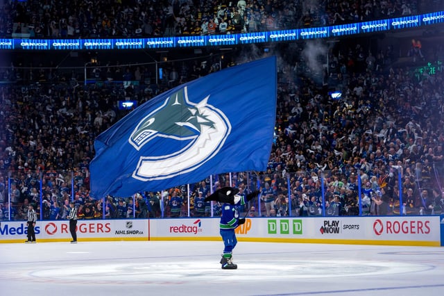 The hometown fans and the team mascot Fin and the Vancouver Canucks celebrate a victory (Bob Frid-USA TODAY Sports)