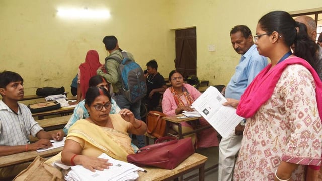 Booth Level Officer (BLO) verify documents of voters during the special intensive revision of electoral rolls in Patna. (HT Photo)