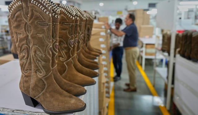 High ankle boots for women for export are kept for packing at a leather footwear manufacturing unit in Agra,
