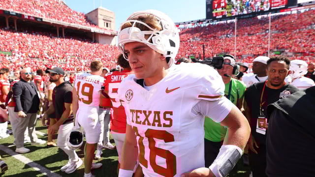 Arch Manning #16 of the Texas Longhorns leaves the field after a 14-7 loss to the Ohio State Buckeyes 
