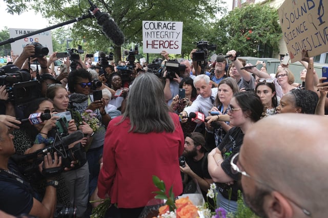 Debra Houry talks to workers and supporters as they rally for departing scientific leaders at the Centers for Disease Control and Prevention outside the CDC headquarters, Thursday, Aug. 28, 2025, in Atlanta. (AP Photo/Ben Gray)