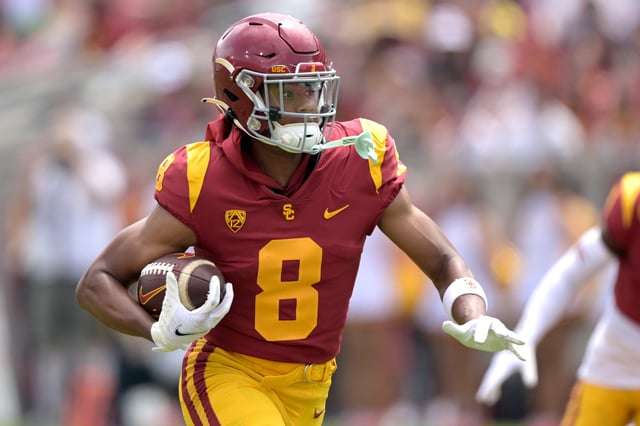 Ja'Kobi Lane #8 of the USC Trojans runs the ball during the Spring football game at United Airlines Field at the Los Angeles Memorial Coliseum on April 20, 2024 in Los Angeles, California.