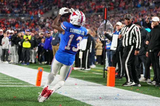 Roderick Daniels Jr. #13 of the SMU Mustangs catches a touchdown during the fourth quar of the 2024 ACC Football Championship at Bank of America Stadium on December 07, 2024 in Charlotte, North Carolina.