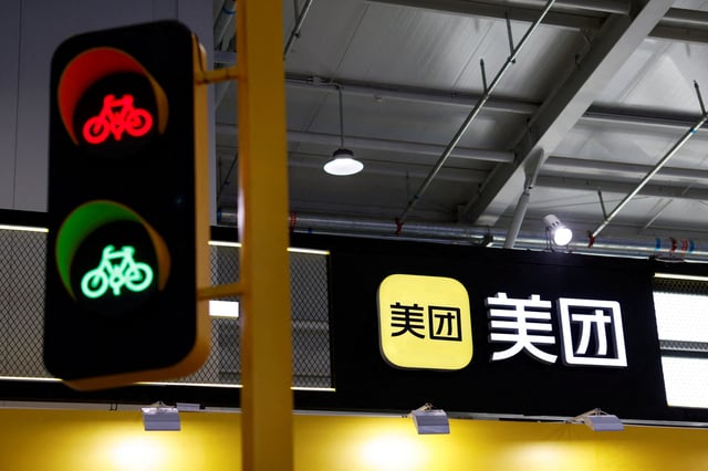 The logo of food delivery giant Meituan is seen at the 2021 China International Fair for Trade in Services (CIFTIS) in Beijing, China, September 3, 2021. REUTERS/Florence Lo/File Photo
