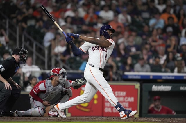 Houston Astros' Jesus Sanchez singles, allowing Jeremy Pena to score during the third inning of a baseball game against the Los Angeles Angels in Houston, Saturday, Aug. 30, 2025. (AP Photo/Ashley Landis)