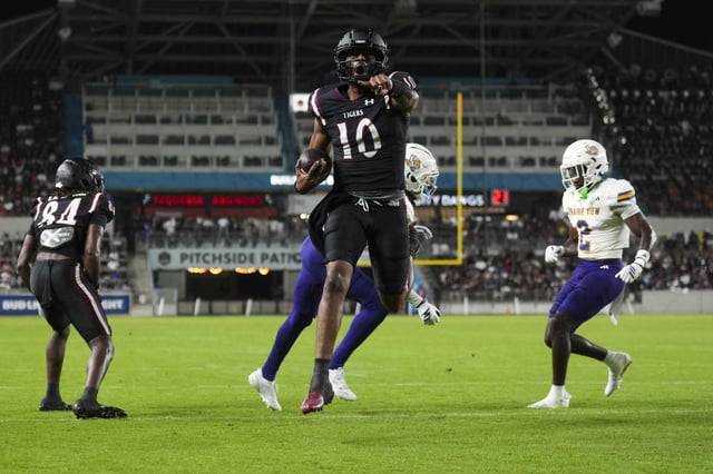 Texas Southern quarterback KJ Cooper (10) reacts after running for a touchdown during the first half of a college football game in Houston, Saturday, Aug. 30, 2025.