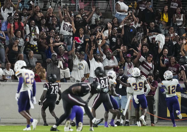 Texas Southern University fans react after a touchdown by running back Athena Renfro during the first half of a college football game in Houston, Saturday, Aug. 30, 2025.