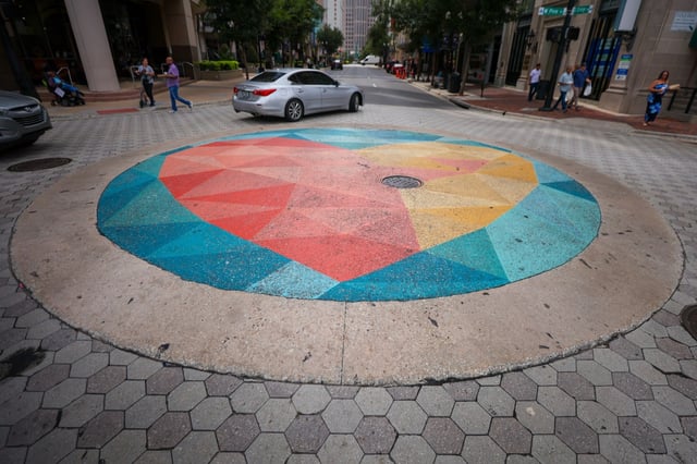 The mural painted on the street at the intersection of S. Orange Ave at E. Pine St. in Orlando on Tuesday, Aug. 26, 2025. The design at the intersection will be removed to comply with a new FDOT policy that requires wiping asphalt art from streets across the state. (Rich Pope/Orlando Sentinel)