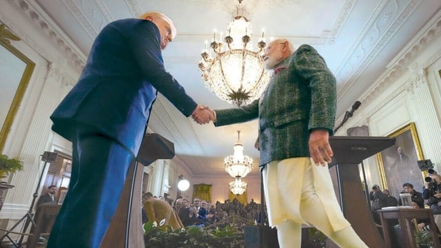 President Donald Trump and Prime Minister Narendra Modi shake hands during a news conference in the East Room of the White House, in Feb