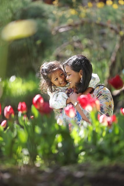 Rini Mathew, with daughter Mariam Ann Joshua, 5, with some of the first tulips to bloom at Araluen Botanic Park this year. Araluen's Springtime Tulip Festival runs from 22 August - 3 October 2025. Danella Bevis