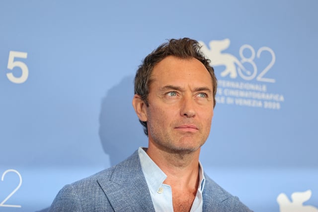 Cast member Jude Law poses during a photocall for the movie "The Wizard of the Kremlin" in competition, at the 82nd Venice Inetrnational Film Festival, in Venice, Italy, August 31, 2025. REUTERS/Yara Nardi