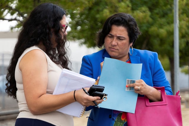 U.S. Representative Emily Randall stands with an aide outside of Northwest ICE Processing Center prior to making an unannounced visit, in Tacoma, Washington, U.S., August 30, 2025. Randall made the visit to check on firefighters detained by U.S. Customs and Border Protection while assisting firefighting efforts at the Bear Gulch Fire in the Olympic National Forest, within her district.
