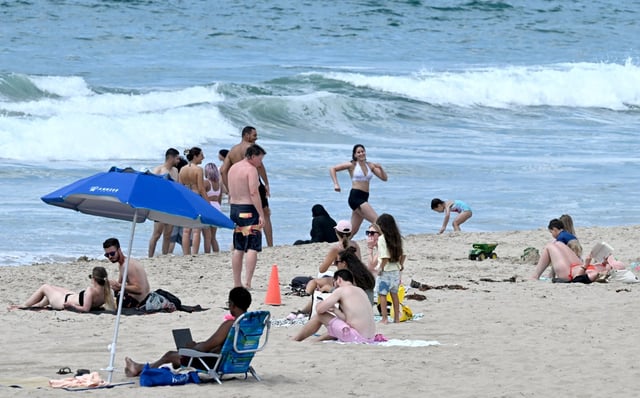 People gather north of the Manhattan Beach Pier on a warm and sunny afternoon just before Labor Day Weekend on Tuesday, Aug. 26, 2025.  (Photo by Dean Musgrove, Los Angeles Daily News/SCNG)