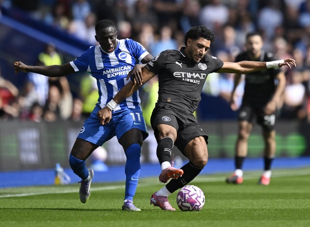 Soccer Football - Premier League - Brighton & Hove Albion v Manchester City - The American Express Community Stadium, Brighton, Britain - August 31, 2025 Manchester City's Omar Marmoush in action with Brighton & Hove Albion's Yankuba Minteh REUTERS/Tony O Brien