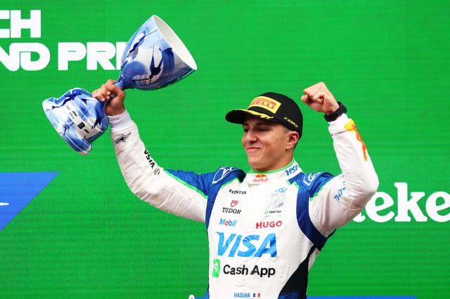 Third placed Isack Hadjar of France and Visa Cash App Racing Bulls celebrates on the podium with his trophy during the F1 Grand Prix of Netherlands at Circuit Zandvoort on August 31, 2025 in Zandvoort, Netherlands.