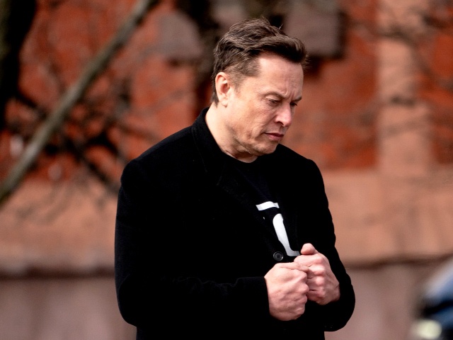 Elon Musk, chief executive officer of Tesla Inc., walks to the Eisenhower Executive Office Building (EEOB) near the White House in Washington, DC, US, on Thursday, Feb. 13, 2025. US President Donald Trump has gravitated toward the reciprocal tariff plan as a key part of his push to raise US levies overall, stating it would apply to nations who generally have a higher average tariff rate than the US, which would raise its own tariff to match them. Photographer: Stefani Reynolds/Bloomberg