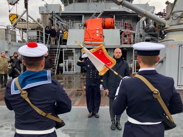 France's Minister for Europe and Foreign Affairs Jean-Noel Barrot stands to attention in front of French navy personnel aboard the BSAM Garonne French navy ship docked in Nuuk, Greenland, on August 30, 2025. (Photo by Will VASSILOPOULOS / AFP) (Photo by WILL VASSILOPOULOS/AFP via Getty Images)