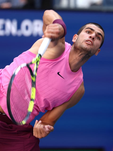 Tennis - U.S. Open - Flushing Meadows, New York, United States - August 31, 2025 Spain's Carlos Alcaraz in action during his fourth round match against France's Arthur Rinderknech REUTERS/Kevin Lamarque