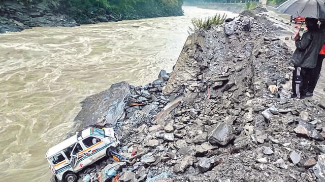 An ambulance veered off the Kiratpur-Manali highway after heavy rain in Mandi on Sunday. (PTI)