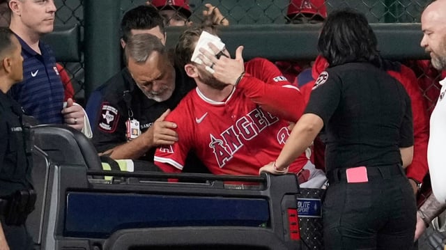 Los Angeles Angels left fielder Taylor Ward is treated for injury against the Houston Astros in Houston.