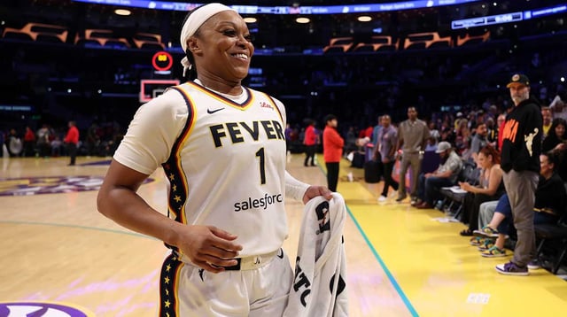 Aug 29, 2025; Los Angeles, California, USA; Indiana Fever guard Odyssey Sims (1) celebrates after defeating the Los Angeles Sparks 76-75 at Crypto.com Arena. Mandatory Credit: Kiyoshi Mio-Imagn Images
