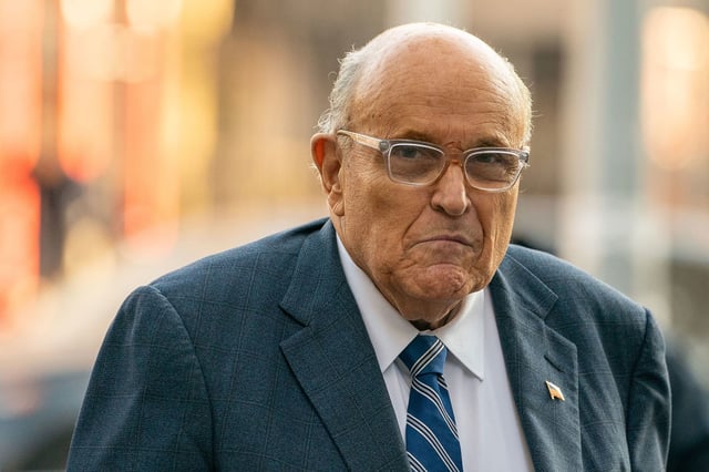 Former New York City Mayor and former lawyer for US President-elect Donald Trump, Rudy Giuliani walks outside United States District Court in Manhattan.