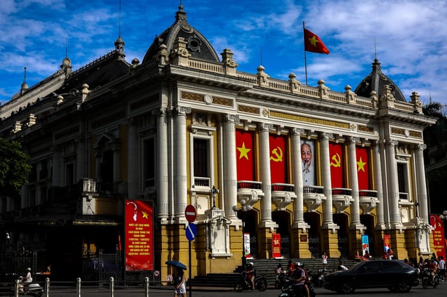 Vehicles drive past Hanoi Opera House, in Hanoi, Vietnam, August 30, 2025. REUTERS/Athit Perawongmetha