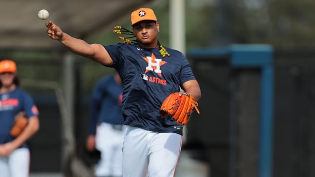 Feb 14, 2025; West Palm Beach, FL, USA; Houston Astros starting pitcher Luis Garcia (77) works on a fielding exercise during a spring training workout at CACTI Park of the Palm Beaches. Mandatory Credit: Sam Navarro-Imagn Images