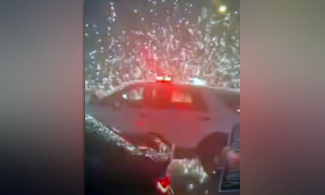 Fireworks explode as police in Secaucus, N.J., try to break up a street-racing event early Sunday. (Secaucus PD)